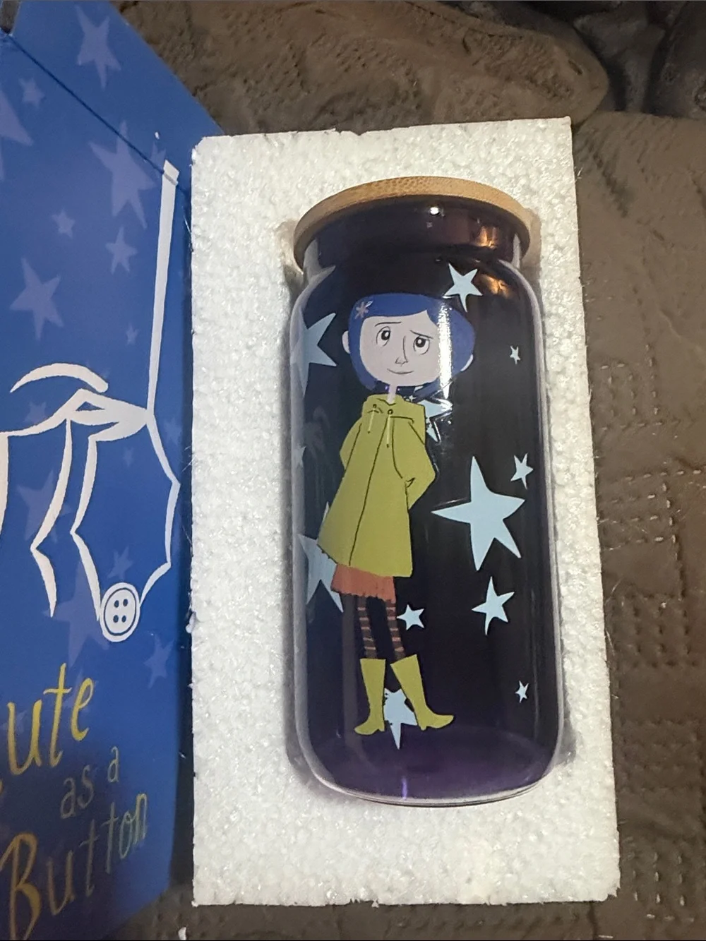 Purple Glass Bottle with Character Print and Yellow Lid